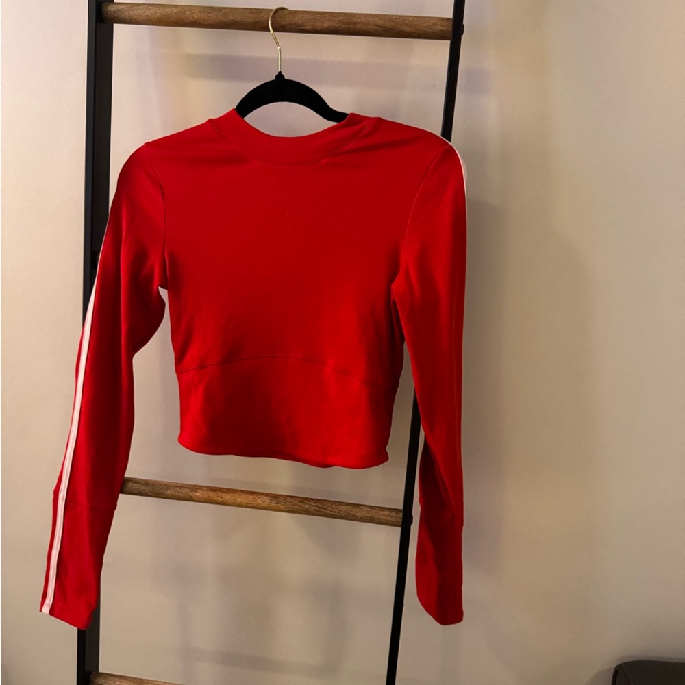 danielletomaszewski Red long sleeve top with white stripe on the sides